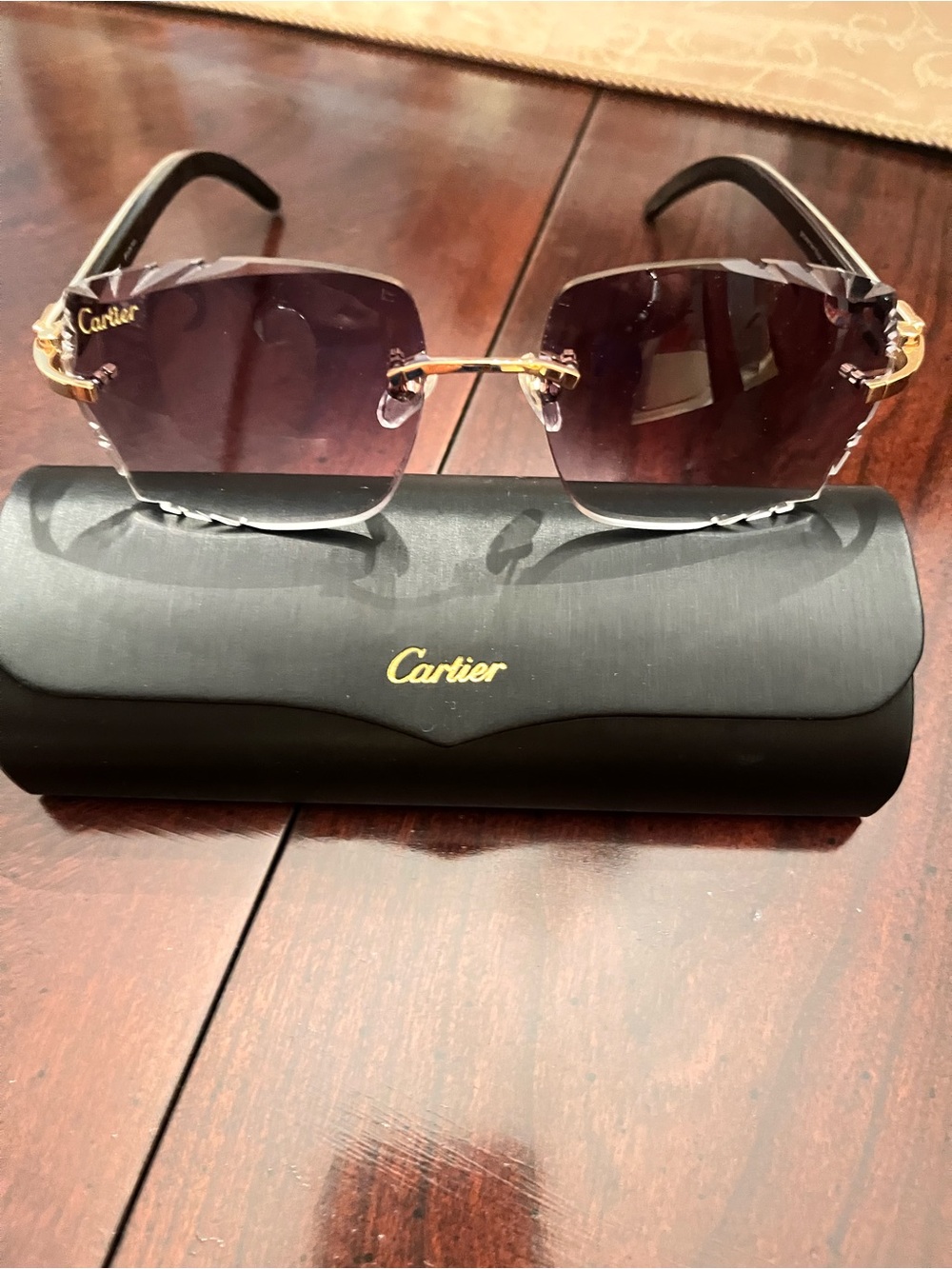 Authentic Cartier Women's Rimless Sunglasses - Black/Purple Lenses.